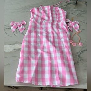 Barbie dress with accessories shown.